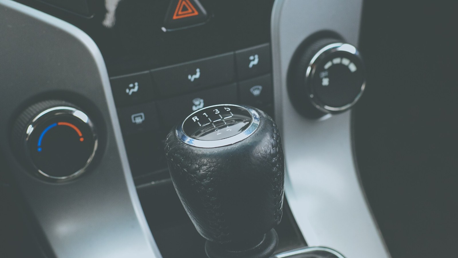 Driver's hands on the steering wheel of a rental car on the Croatian coast
