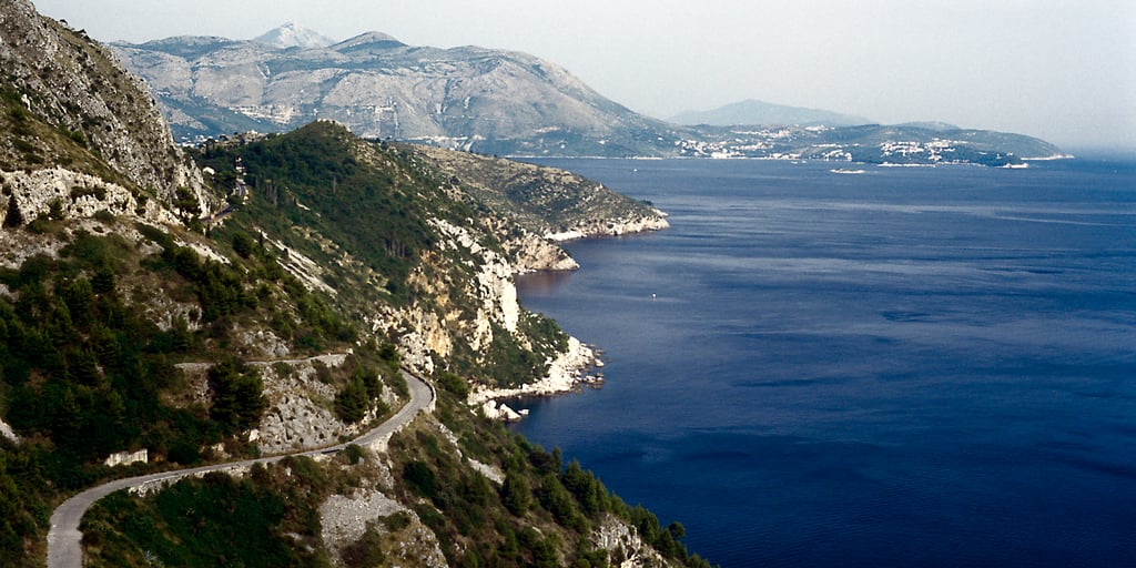 Car hire with a driver in Dubrovnik: the old Adriatic coast road winding south towards Cavtat, high above the sea
